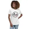 womens-relaxed-t-shirt-white-front-685479788dcd5.jpg Woman wearing travel-themed shirt with airplane graphic.