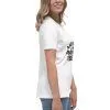 Woman wearing white printed T-shirt, side view