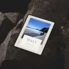 Maui Travel Guide-ipad-pro-mockup-on-rugged-stone-surface-min Tablet displaying Maui travel guide cover.